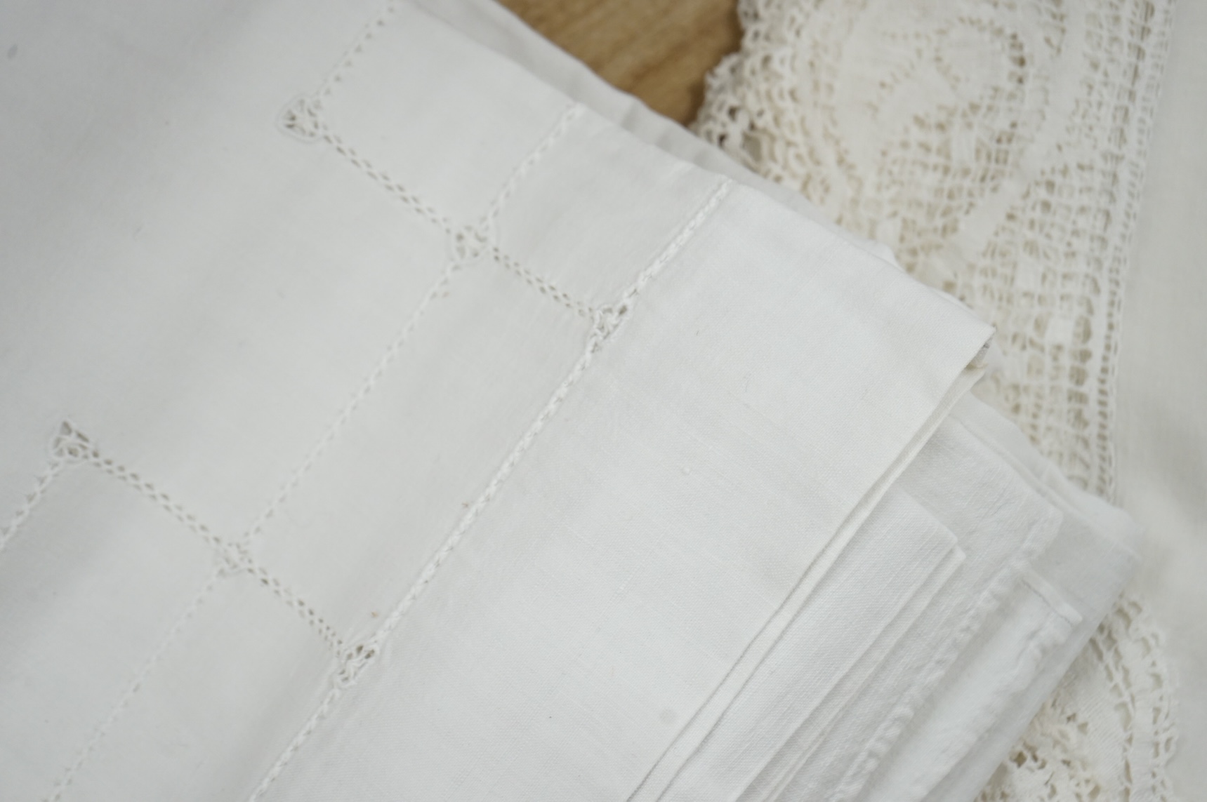 A French provincial linen sheet with lace edge and insertions plus a pair of similar sheets with drawn thread and monograms